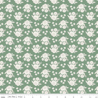 White floral pattern on a green background
